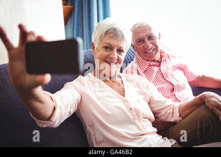 Smiling senior couple taking a selfie Stock Photo