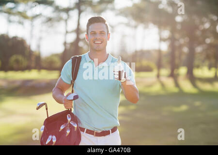 Portrait of smiling golfer man showing thumbs up Stock Photo