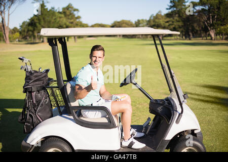 Portrait of golfer man showing thumbs up Stock Photo