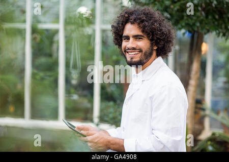 Portrait of male scientist using digital tablet Stock Photo