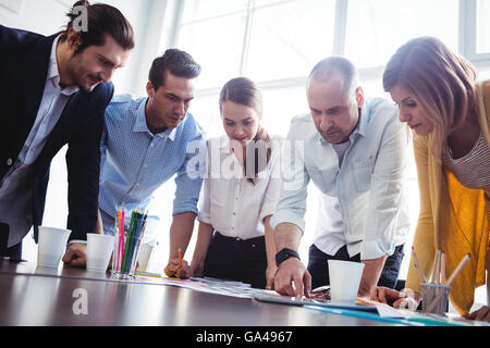 Serious photo editors looking at photos Stock Photo