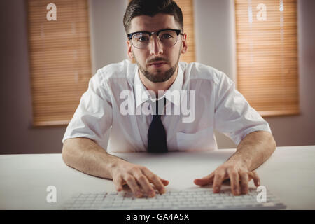 Portrait of man wearing eyeglass in office Stock Photo