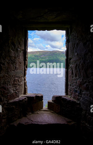Urquhart Castle sits beside Loch Ness in the Highlands of Scotland Stock Photo