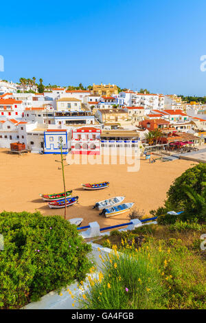 A view of Carvoeiro fishing village with colourful houses on beach, Algarve, Portugal Stock Photo