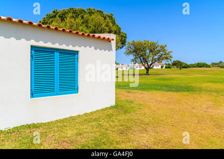 Garden with typical holiday house in Alvor town, Algarve region, Portugal Stock Photo