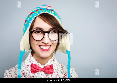 Portrait of Funny Hipster Girl in Winter Hat Stock Photo