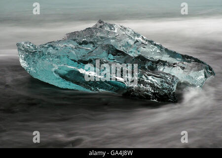 Iceberg on black sand beach Stock Photo