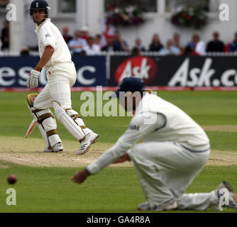 Cricket - npower Second Test - England v India - Day One - Trent Bridge. England's Alastair Cook hits past India's VVS Laxman during the Second npower Test match at Trent Bridge, Nottingham. Stock Photo