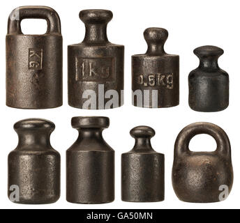 Old rusty iron scale weights isolated on white Stock Photo