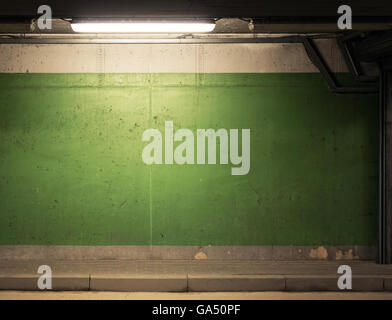 Dirty concrete garage wall with lamp Stock Photo