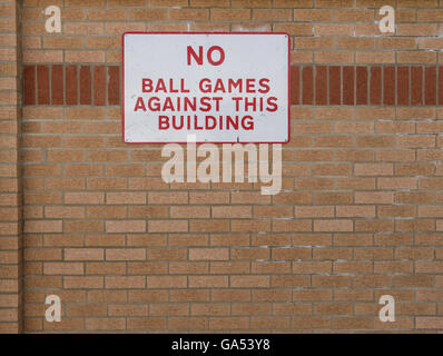 No ball game sign seen attached to the outside of a wall at an education centre. Stock Photo