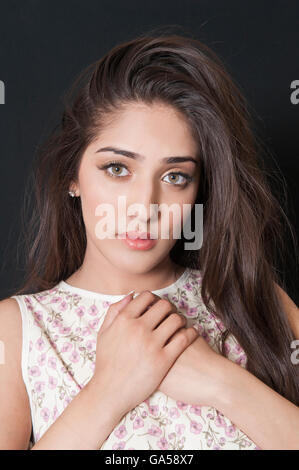 Beautiful woman hands over heart Stock Photo