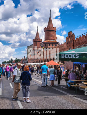 Berlin, Germany, 3rd July 2016. The Open Air Gallery is held twice every year and is open to professionals and young talents. More than a hundred artists display their works on the historic Oberbaum bridge between Kreuzberg and Friedrichshain.  Credit:  Eden Breitz/Alamy Live News Stock Photo