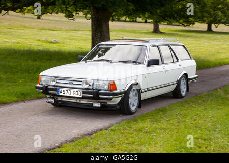 1984 80s eighties White Ford Granada estate at Leighton Hall Classic Car Rally, Carnforth, Lancashire, UK. July, 2016.  The annual classic car rally takes place at the magnificent Leighton Hall in Carnforth in Lancashire.  British classic sports cars ranging from MG's to American muscle cars like the Dodge Vipers & Ford Mustangs.  The spectator event drew thousands of visitors to this scenic part of the country on the north west coast of England. Stock Photo