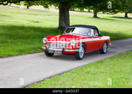 Red 1970 70s MGB at Leighton Hall Classic Car Rally, Carnforth, Lancashire, UK. 3rd July, 2016.  The annual classic car rally takes place at the magnificent Leighton Hall in Carnforth in Lancashire.  British classic sports cars as the spectator event drew thousands of visitors to this scenic part of the country on the north west coast of England.  Credit:  Cernan Elias/Alamy Live News Stock Photo