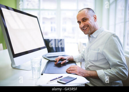 Graphic designer using computer Stock Photo