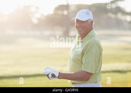 Portrait of smiling mature golfer