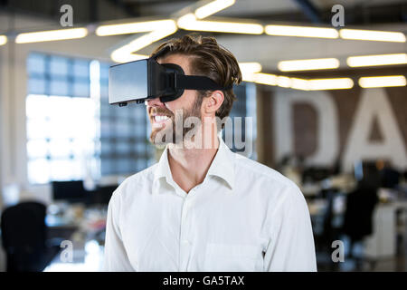 Businessman using virtual reality simulator Stock Photo