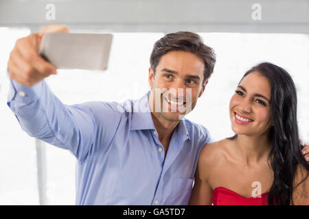 Couple taking a selfie in cafe Stock Photo