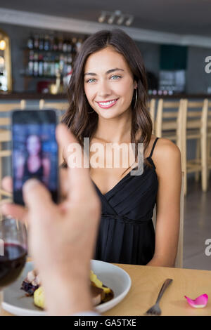 Man taking photograph of beautiful woman Stock Photo