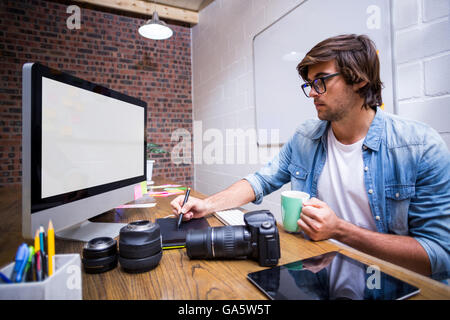 Focused man using computer in office Stock Photo