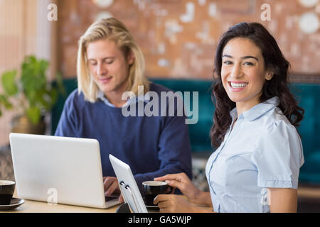 Business colleagues using laptop and digital tablet Stock Photo