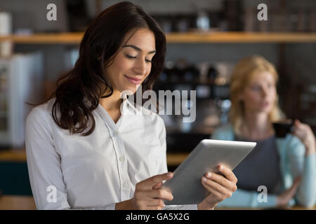 Close-up of businesswoman using digital tablet Stock Photo