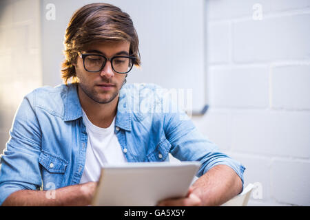 Man using digital tablet Stock Photo