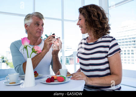 Man gifting ring to woman Stock Photo