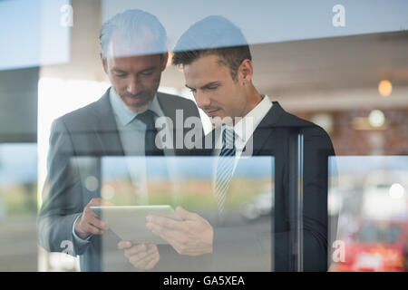 Two businessmen using digital tablet Stock Photo