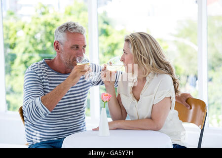 Mature couple drinking white wine Stock Photo