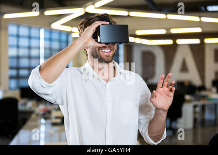 Businessman wearing virtual reality simulator Stock Photo