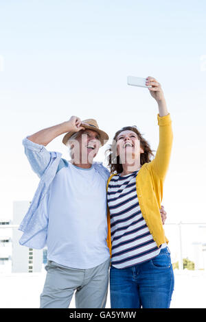 Smiling couple taking selfie Stock Photo