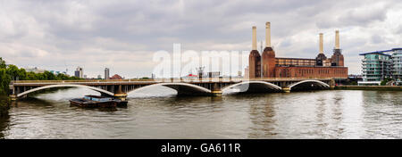 Panoramic view of a rail bridge over the River Thames and Battersea Power Station in London, UK Stock Photo