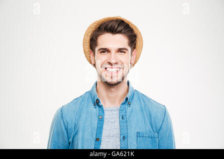 Cheerful attractive young man in hat and blue shirt over white background Stock Photo