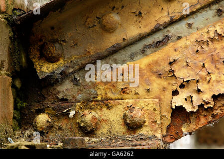 Rivets in joint between old rusty steel beams. Stock Photo