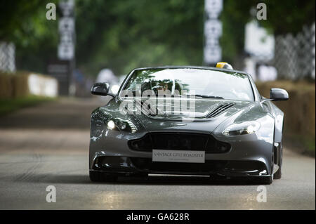 An Aston Martin Vantage GT12 Roadster drives up the hill at the Goodwood Festival of Speed 2016 Stock Photo