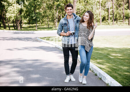 Portrait of a beautiful young couple walking in park together Stock Photo