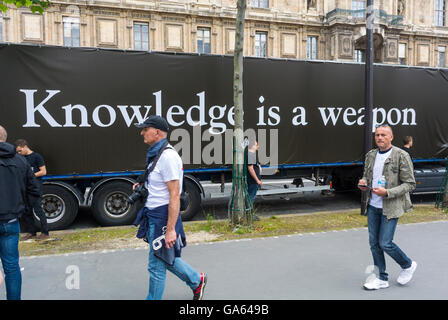 Paris, France,  French Gay Pride, LGBT Activism, Act Up-Paris Truck with AIDS Slogan 'Knowledge is a Weapon' on Street, act up poster, aids prevention poster,  hiv parade Stock Photo