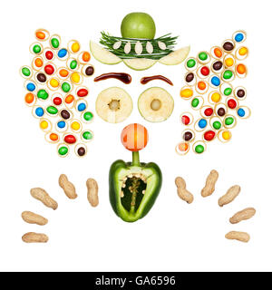 Funny clown made of vegetables and fruits in a kids menu isolated on white. Stock Photo