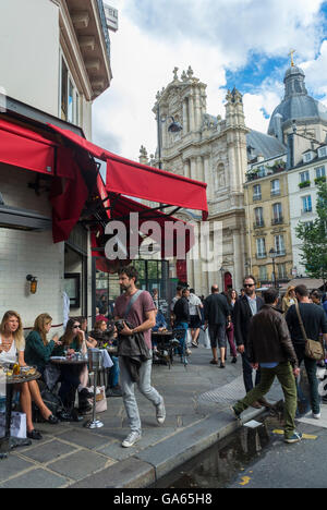 Paris, France, Busy Street Scenes, in the Marais DIstrict, Crowd of People Sharing Drinks on French Cafe Terrace with Saint Paul Church in Back, Local neighbourhoods Stock Photo