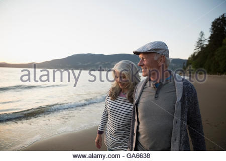 Couple walking on nude beach Stock Photo - Alamy