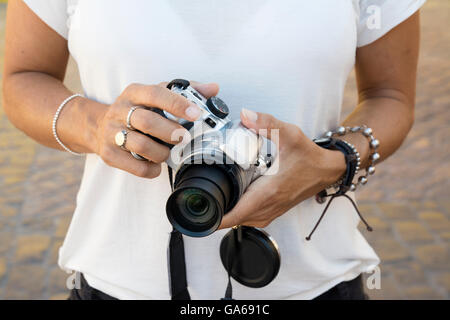 camera woman, With bracelets on their hands Stock Photo