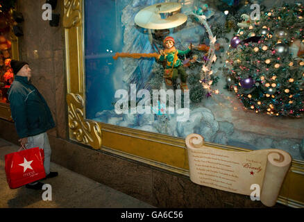 6 December 2006 - New York City, NY - A man watches a Christmas window display at the Macy's department store in New York City, Stock Photo