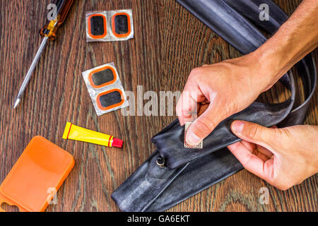 bicycle repair kit, wheels camera on  wooden background Stock Photo