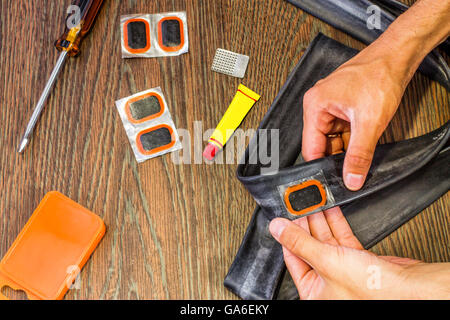 bicycle repair kit, wheels camera on  wooden background Stock Photo