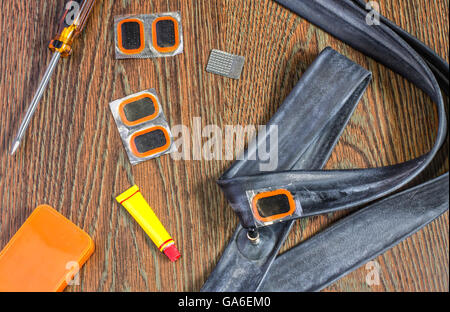 bicycle repair kit, wheels camera on  wooden background Stock Photo