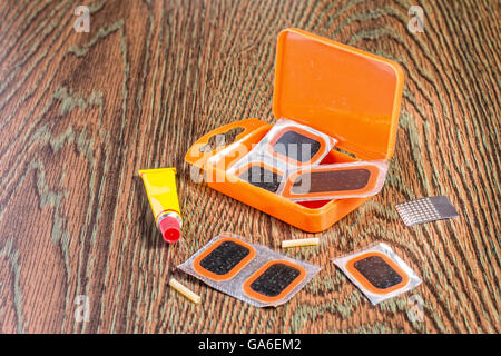 bicycle repair kit, wheels camera on  wooden background Stock Photo