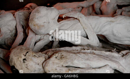 The remains of victims laid to rest at the Murambi Genocide Memorial, Rwanda on the 13th anniversary of the 1994 Rwandan Genocide. Stock Photo