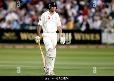 Cricket - npower First Test - England v India - Day Three - Lord's. England's Alastair Cook walks off dejected after being dismissed Stock Photo